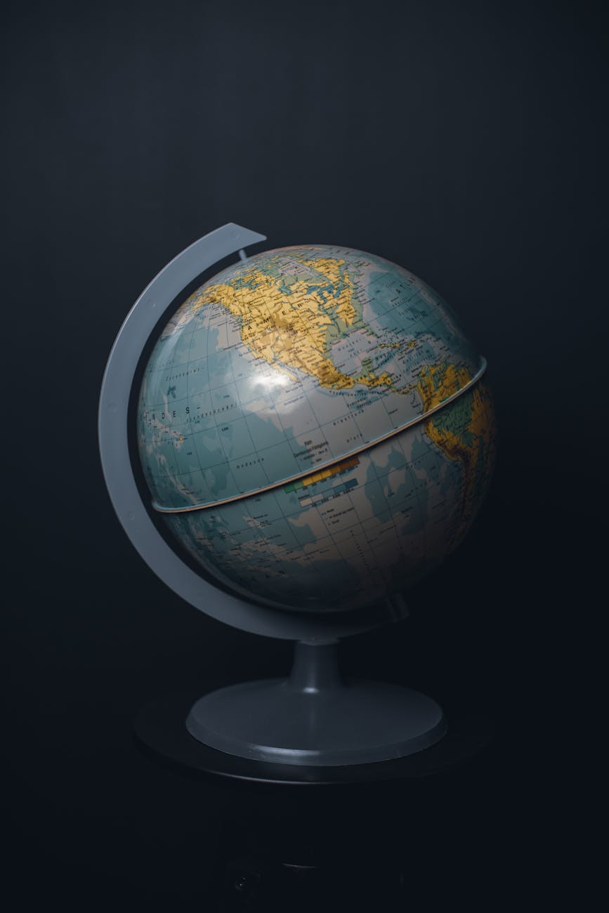 globe on stand against black background