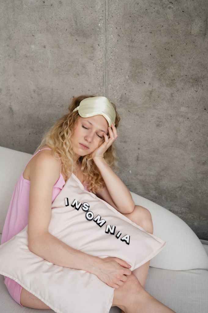 woman sleeping while sitting